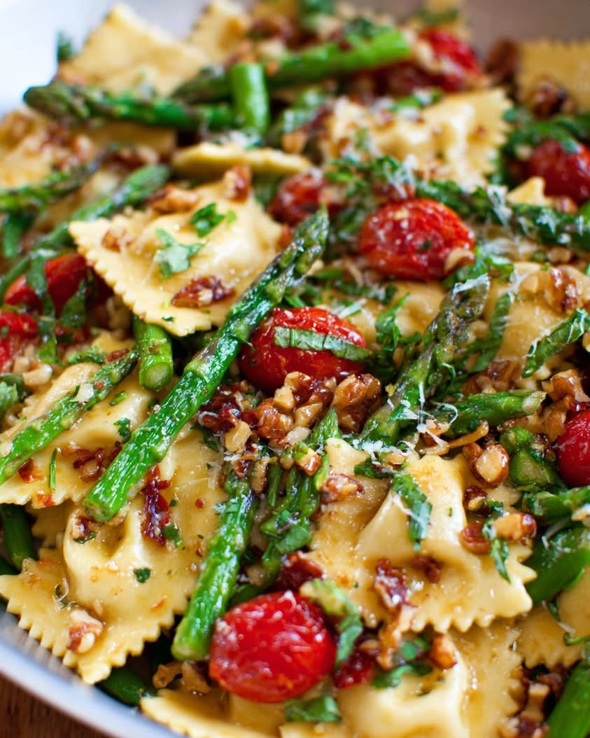 Spring Ravioli with Tomatoes, Asparagus, and Walnut Herb Sauce 3 ravioli tomatoes asparagus garlic walnuts