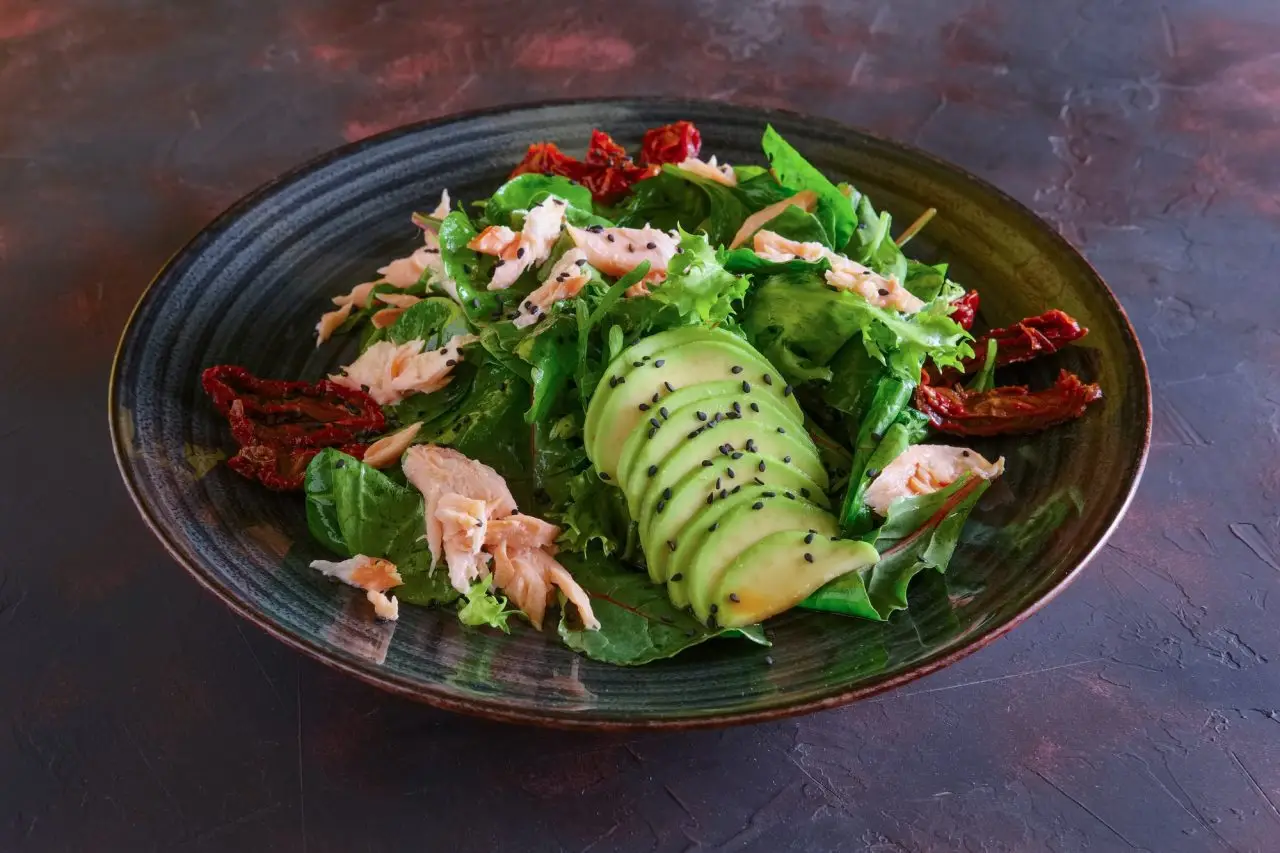 salad with salmon avocado and sun dried tomatoes