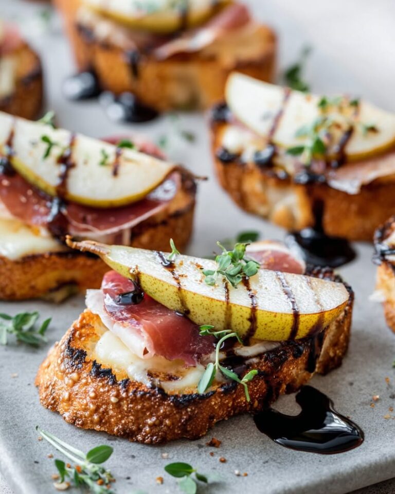 Pear, Brie, and Prosciutto Crostini with Balsamic Honey